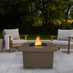 Brown Fire Pit Table with Chairs and View of Trees