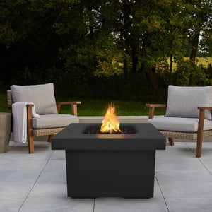 Black Fire Pit Table with Chairs and View of Trees