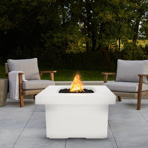 White Fire Pit Table with Chairs and View of Trees